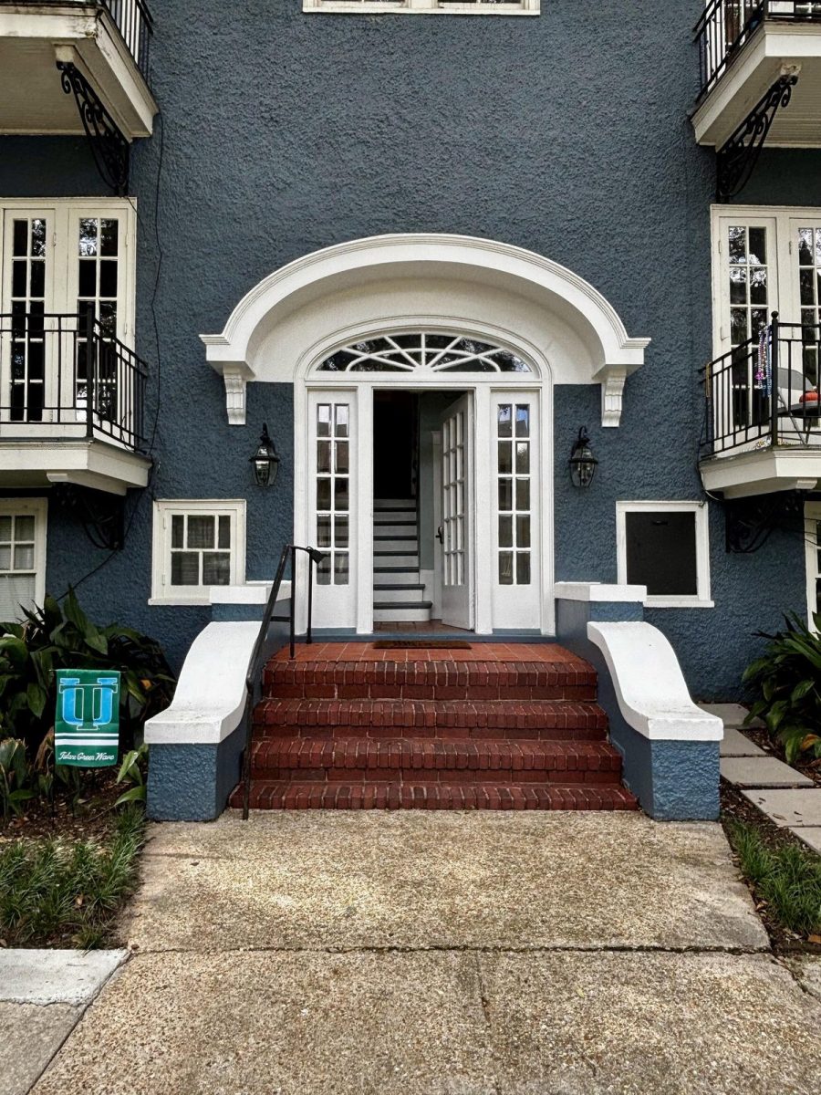Arched front entrance and brick steps at 7934 Willow Street