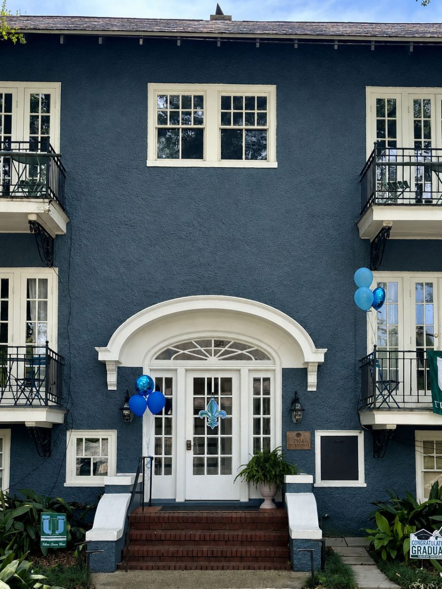 The full building at 7934 Willow Street beneath the oaks