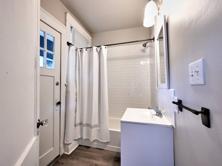 Full bathroom with a tub and shower