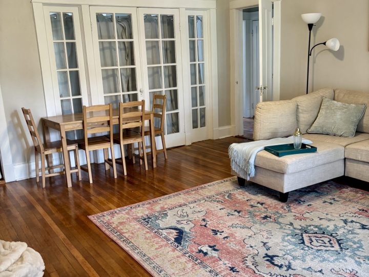 Living and dining area with French doors and a dining table for six