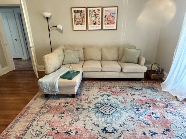 Living room seating area viewed toward the hallway