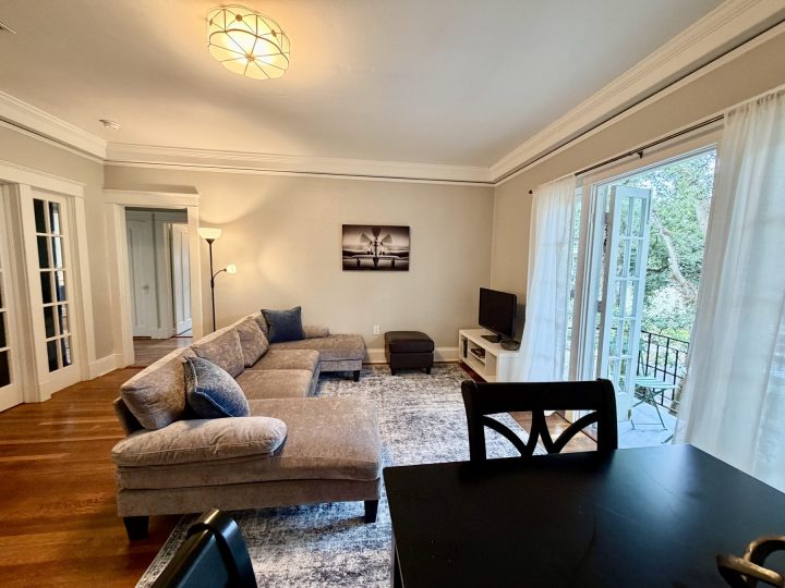 Living and dining room with a black high-top dining set
