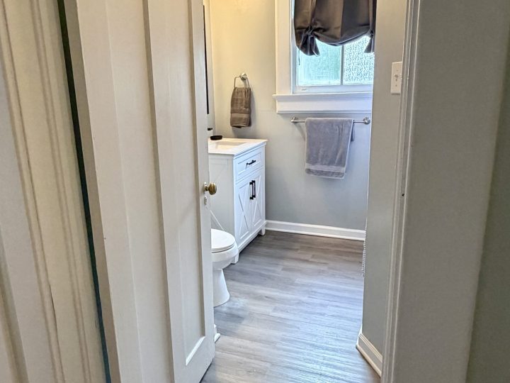 Hallway leading to the second full bathroom