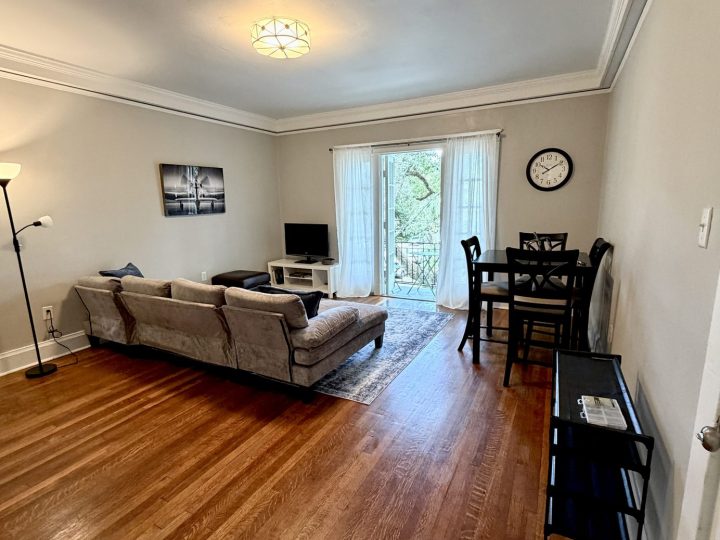 Open living room looking toward the balcony doors